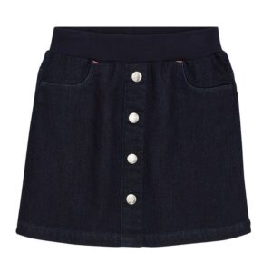 Jupe en denim bleu avec boutons en argent.